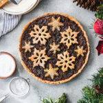 Top down view of a Christmas mincemeat tart, decorated with pastry snowflakes.