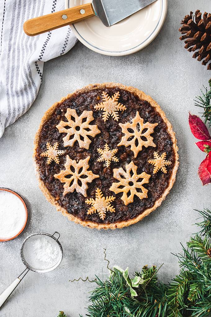 Top down view of a Christmas mincemeat tart, decorated with pastry snowflakes.