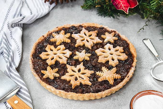 A Christmas mincemeat tart, decorated with pastry snowflakes.