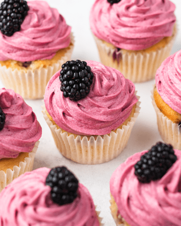 Cupcakes with blackberry frosting and fresh blackberries on top