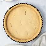 Top down view of a pie crust in a tin