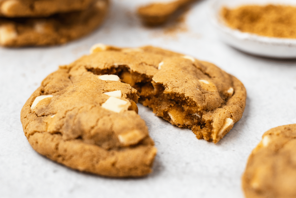 Close up of a chewy ginger cookie that has been split in half