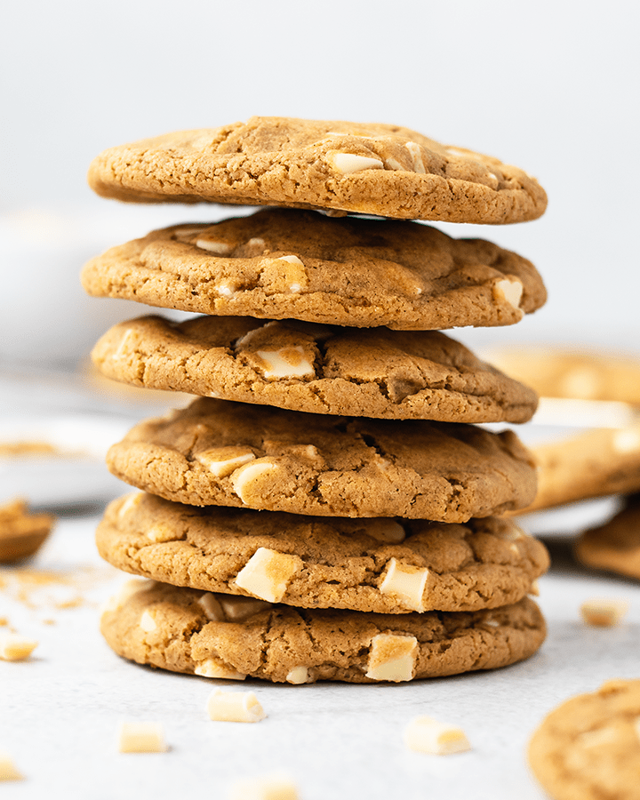 Close up of a stack of white chocolate ginger cookies
